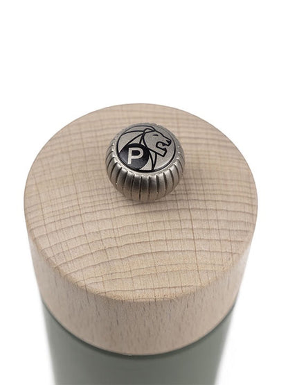 Eclectic Peugeot Boreal pepper mill top view showing the natural beechwood finish and metal adjustment knob