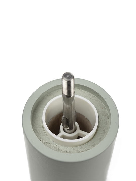 Eclectic Peugeot Boreal salt mill in sage green beechwood showing the internal Zirlion grinding mechanism top view