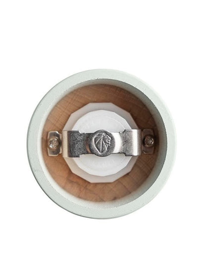 Eclectic Peugeot Boreal salt mill top view showing the Zirlion grinding mechanism inside the sage green beechwood body