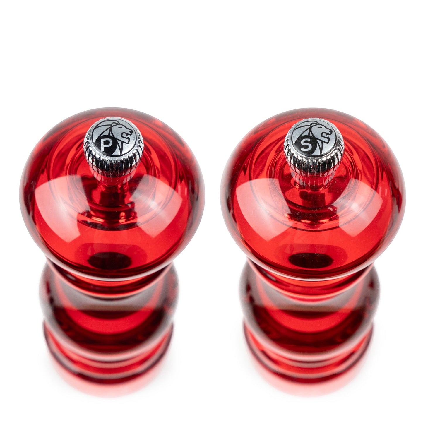 Eclectic Peugeot Podium red acrylic salt and pepper mill set, 18 cm tall, viewed from above.