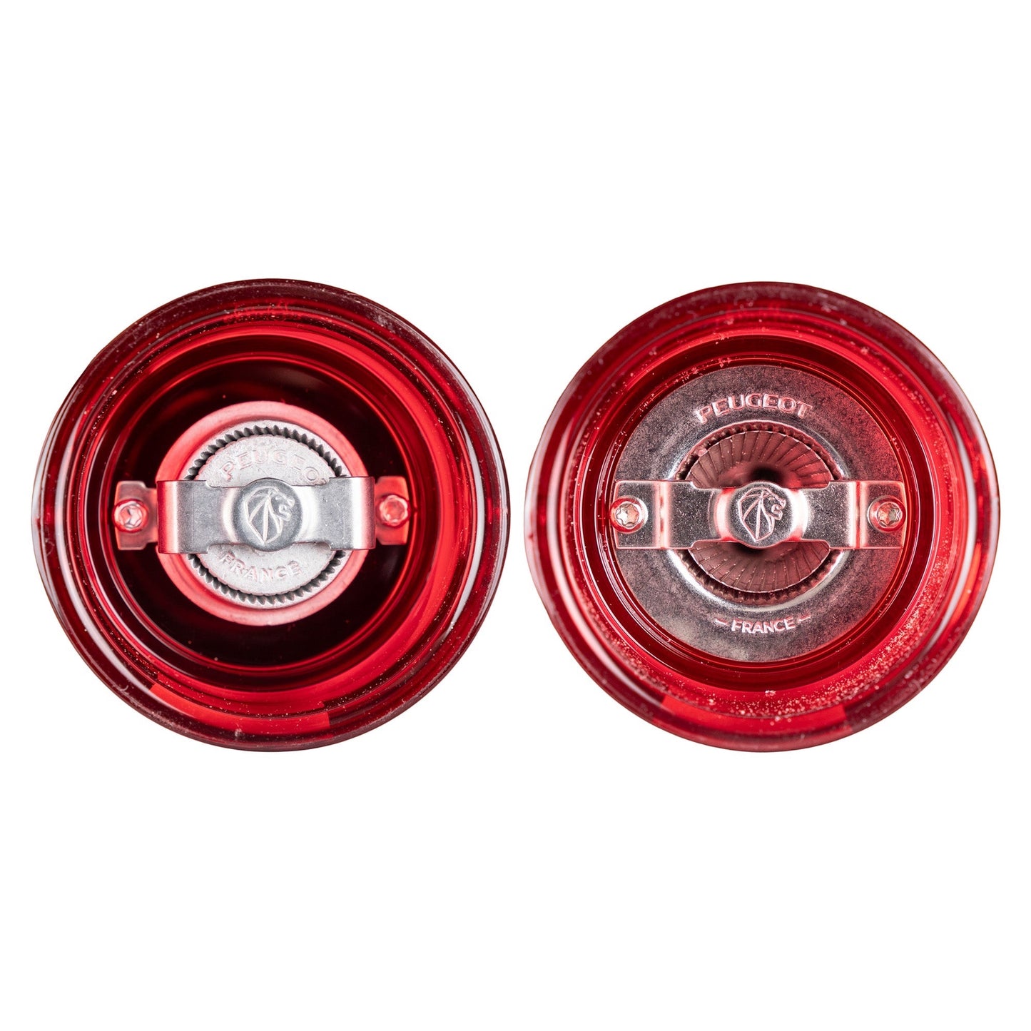 Eclectic Peugeot Podium red acrylic salt and pepper mills top view showing precision steel grinding mechanisms