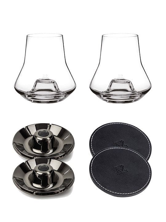 Eclectic Peugeot whisky tasting set with two glasses, chilling bases, and black leather coasters on white background.