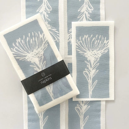 Eclectic Pincushion Blue disposable airlaid napkins with a botanical protea print in a pack of 25