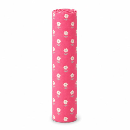 Eclectic pink cotton flannel baby blanket featuring a delicate white blossom floral pattern, rolled for storage.