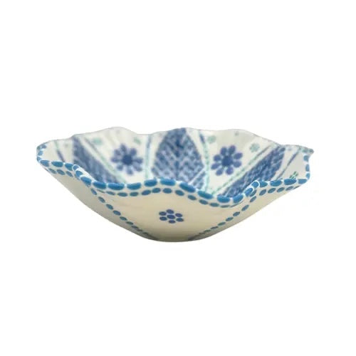 Eclectic Poppy ceramic pasta bowl with blue floral patterns and a scalloped edge on a white background