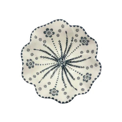 Eclectic Potterseed Poppy ceramic pasta bowl with a scalloped edge and blue floral pattern on a white background