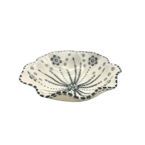 Eclectic Potterseed Poppy ceramic pasta bowl with a white base and delicate black floral pattern and scalloped edge.