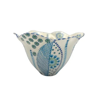 Eclectic Potterseed tulip-shaped ceramic bowl with blue and green floral patterns and curved edges