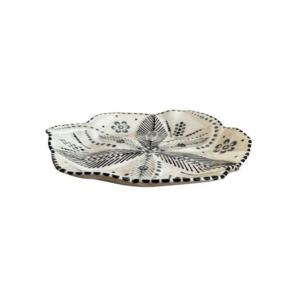 Eclectic Potterseed handcrafted ceramic side plate with a tulip-inspired shape and black botanical floral pattern.