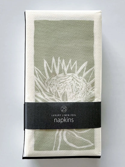 Eclectic pack of 25 green and white botanical protea print airlaid napkins with a premium linen-like texture.