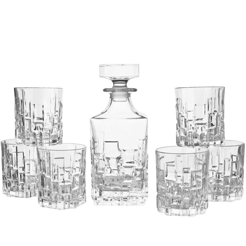 Eclectic RCR Etna 7-piece clear crystal whisky decanter and tumbler set with geometric cut patterns.