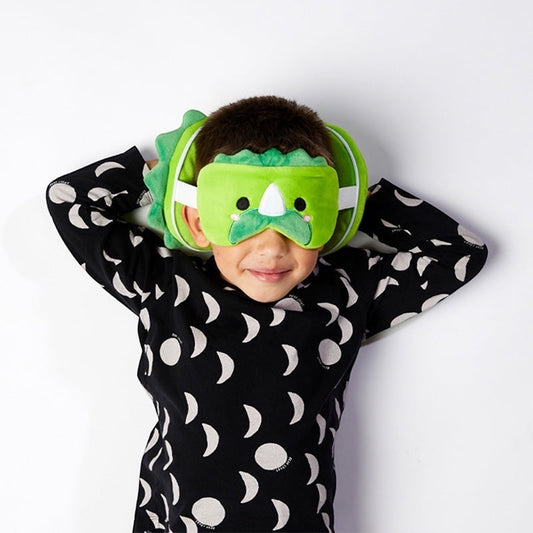 Child wearing Eclectic Relaxeazzz Huck the Dinosaur green plush travel neck pillow and matching eye mask