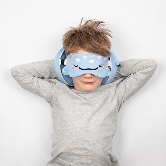 Eclectic Relaxeazzz Aoi the Whale Shark travel pillow and matching eye mask worn by a young boy on a white background.