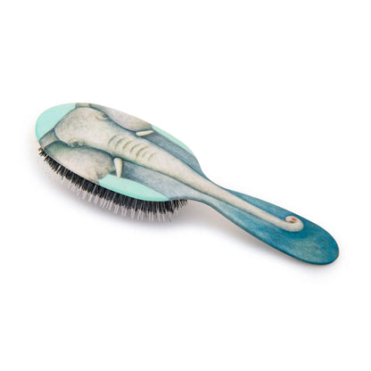 Eclectic Rock & Ruddle baby hairbrush featuring a blue elephant illustration with natural boar bristles and nylon tips.