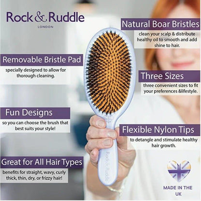 Eclectic Rock & Ruddle baby hairbrush with boar bristles and nylon tips, featuring a lion design and removable pad.