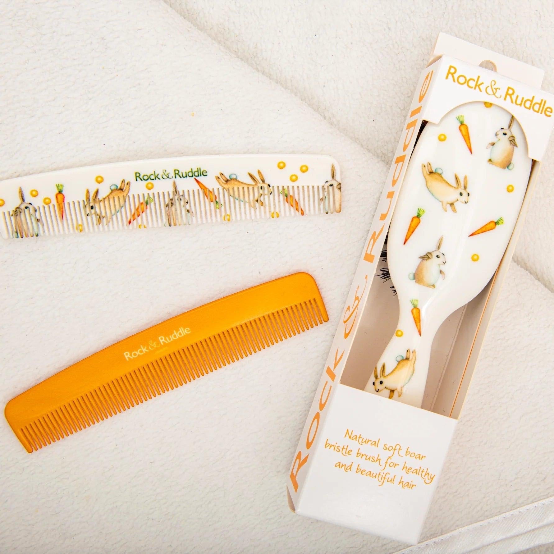 Eclectic Rock & Ruddle baby hairbrush and two combs featuring charming rabbit and carrot illustrations on a white background