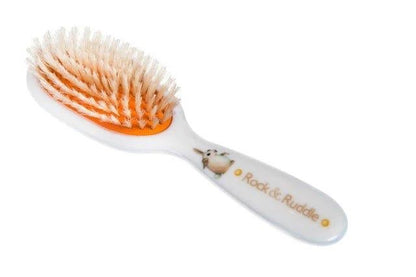 Eclectic Rock & Ruddle baby hairbrush with a white handle, rabbit illustration, and natural boar bristles.