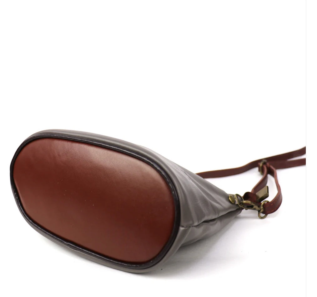 Eclectic Roma leather crossbody bag featuring a brown leather base and grey sides with gold-tone hardware details.