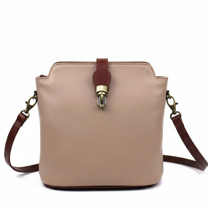 Eclectic Roma leather crossbody bag in beige with tan trim, gold hardware, and a decorative buckle detail.