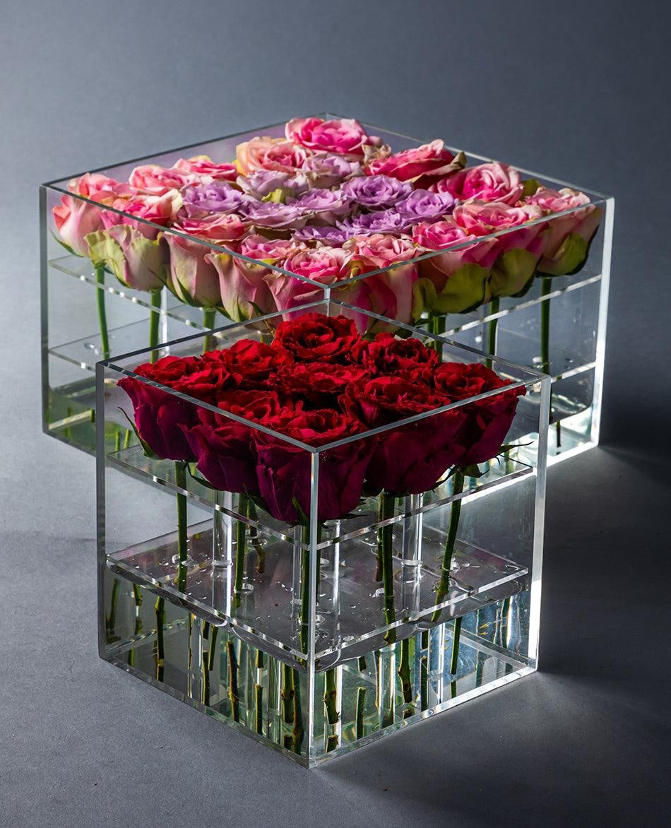 Eclectic Rose Box set featuring fresh pink, purple, and deep red roses in clear acrylic square display cases.