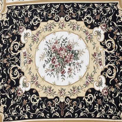 Eclectic round tablecloth featuring a black, gold, and ivory baroque floral pattern on lightweight fabric.