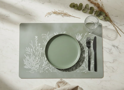 Eclectic sage green paperboard placemat with white botanical fynbos illustration on a marble table setting