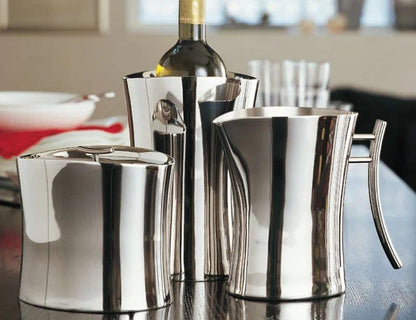 Eclectic Sambonet Bamboo collection mirror-polished stainless steel wine cooler and pitcher set on a dining table