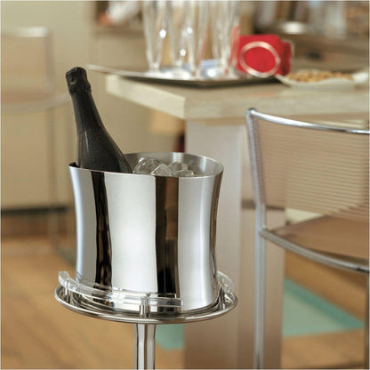 Eclectic Sambonet Bamboo mirror-polished stainless steel wine cooler holding a bottle of champagne on a stand.