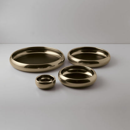 Eclectic Sambonet Sphera champagne PVD stainless steel serving bowls in four sizes with smooth organic silhouettes.