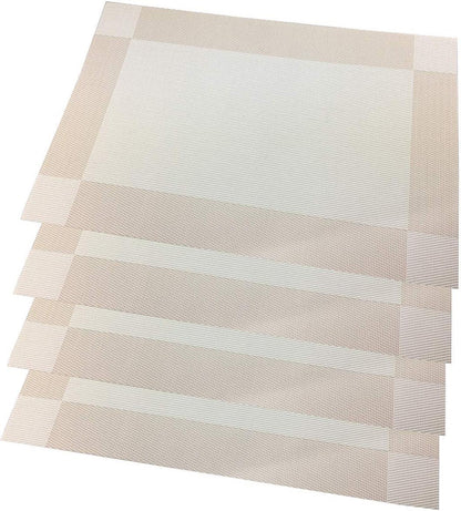 Eclectic set of four rectangular sand-coloured woven PVC placemats with a subtle textured border.