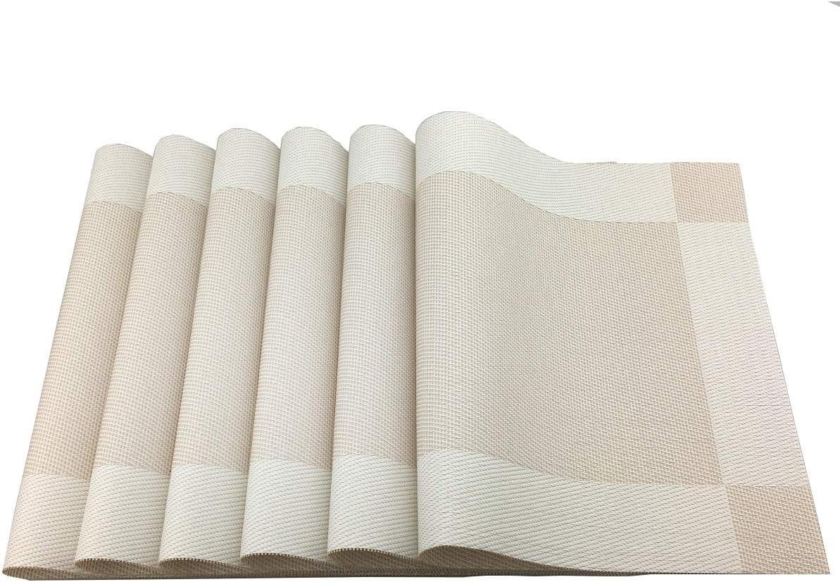 Eclectic set of four rectangular sand-coloured woven PVC placemats with a subtle textured finish.