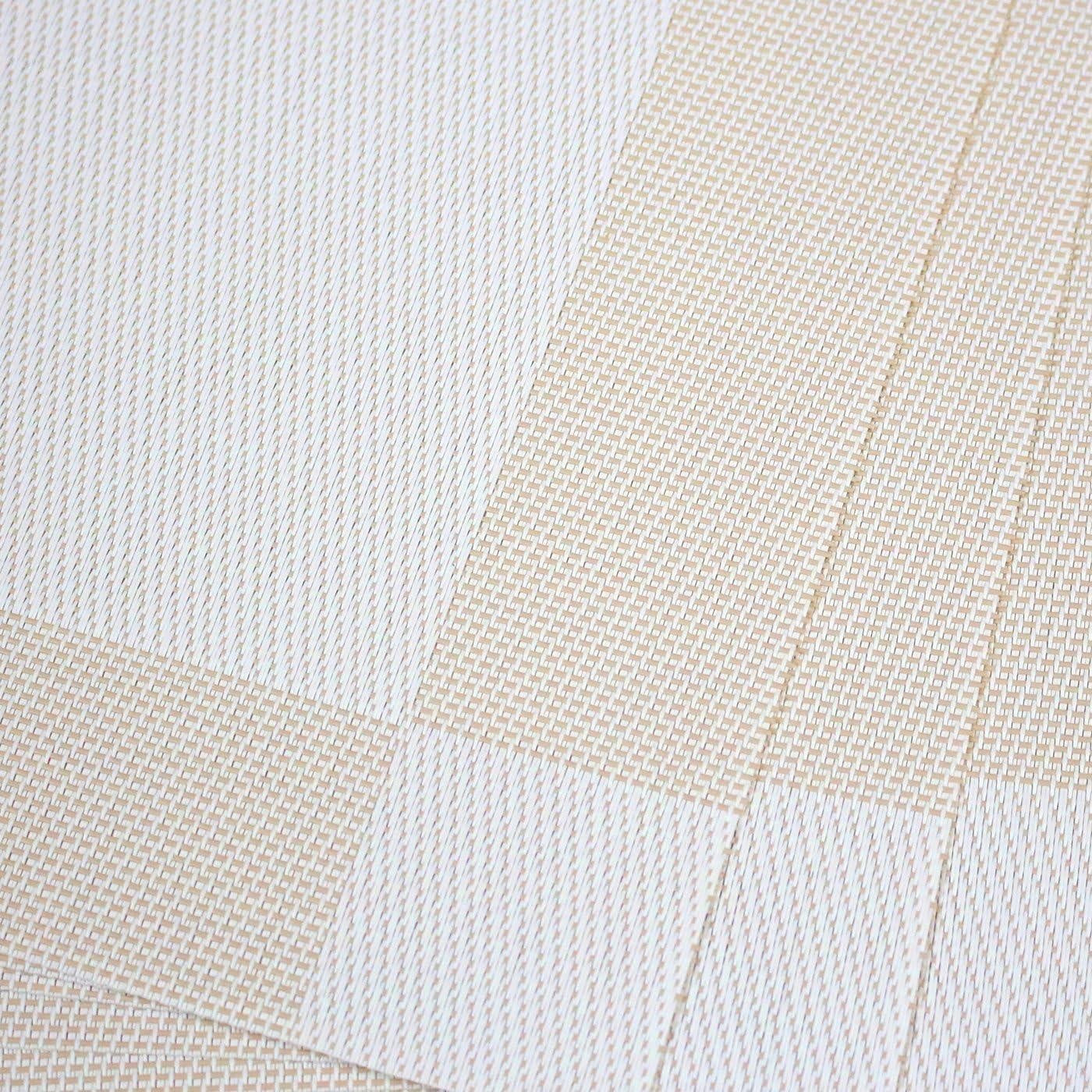 Eclectic sand-coloured rectangular PVC placemats with a subtle woven texture for a refined table setting.