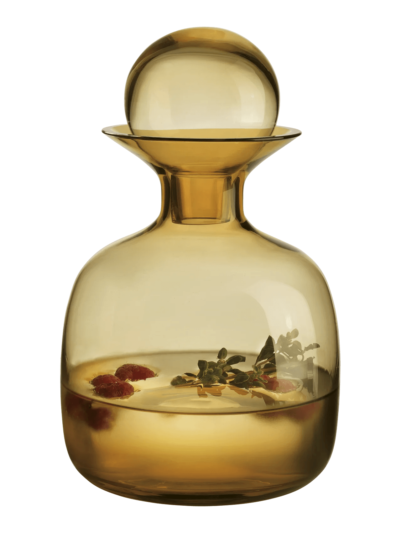 Eclectic Sarabi amber mouth-blown glass carafe with a spherical stopper, filled with infused water and berries.