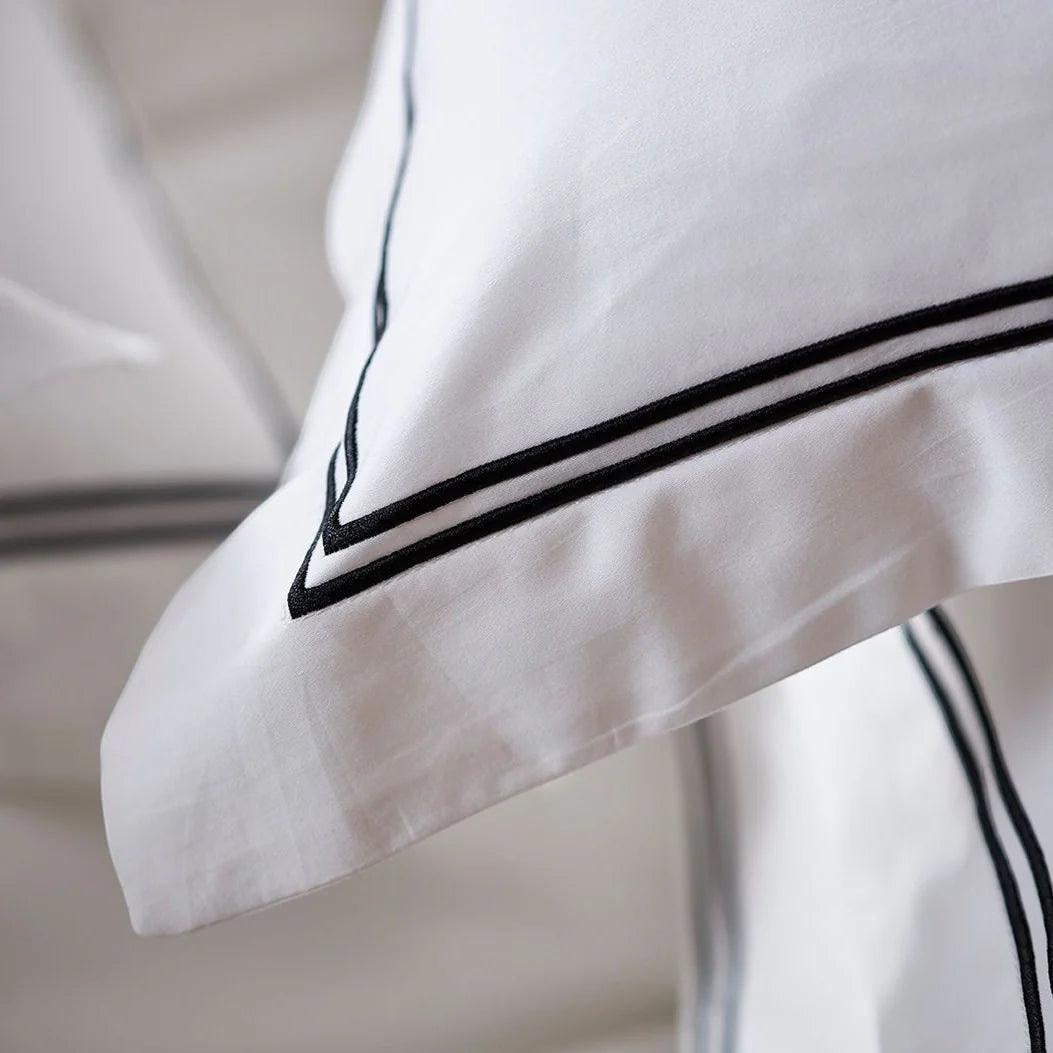 Eclectic Saxon white cotton sateen duvet cover with elegant black satin stitch double border detail.