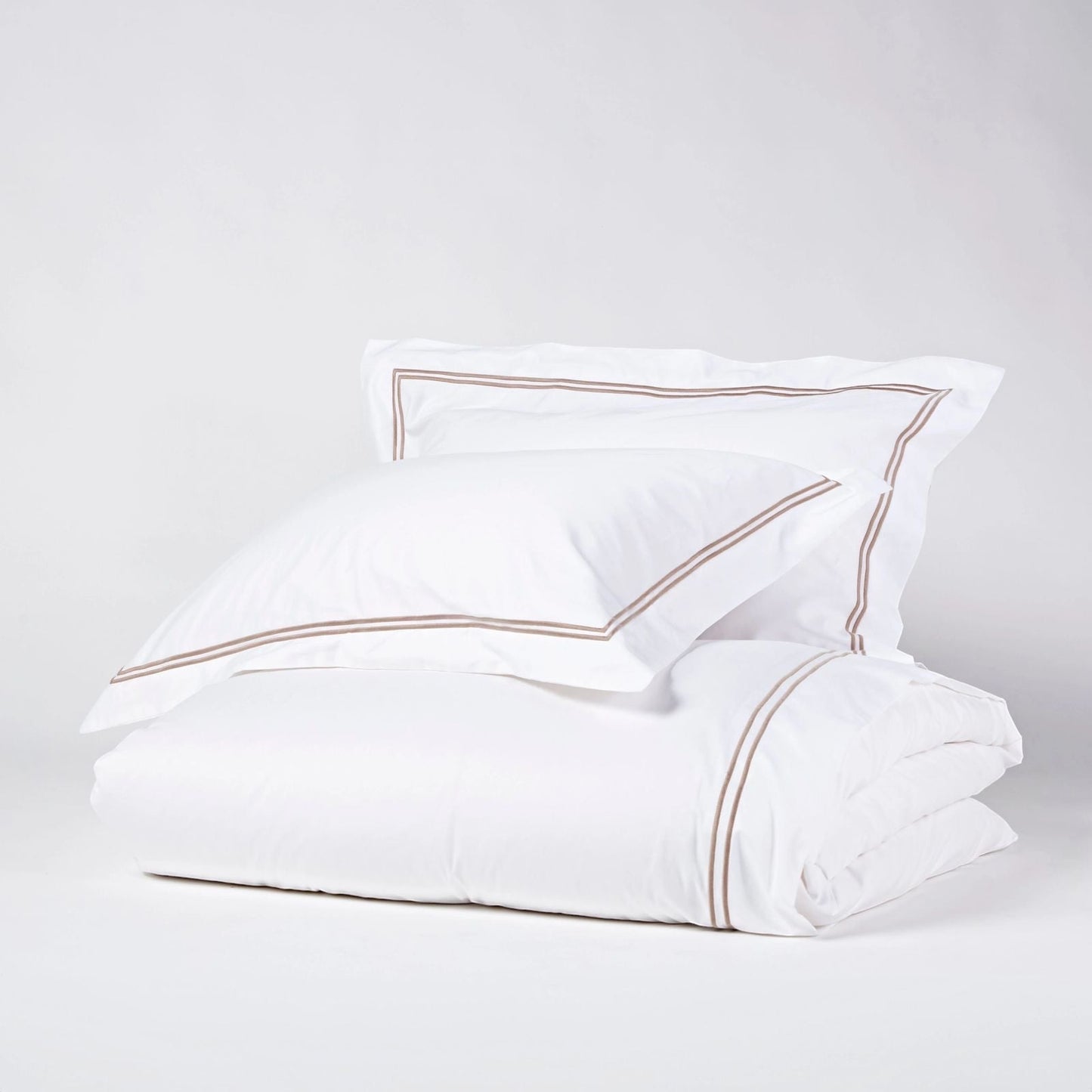 Eclectic Saxon white cotton sateen duvet set with elegant stone-coloured double satin stitch detail.