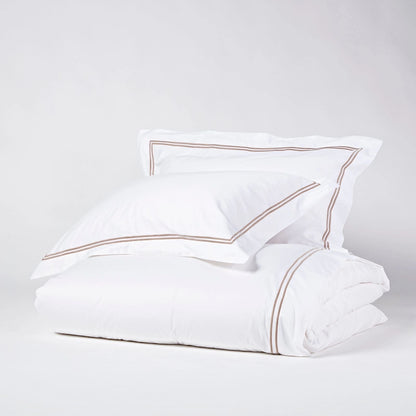 Eclectic Saxon white cotton sateen duvet set with elegant stone-coloured double satin stitch detail.
