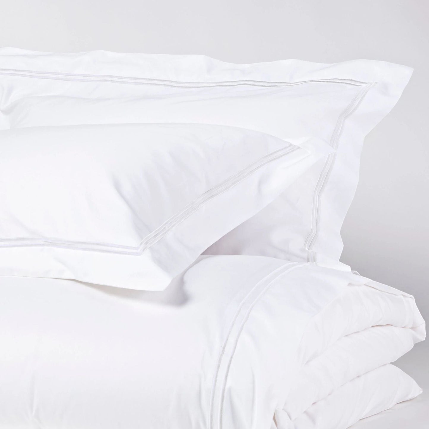 Eclectic Saxon white cotton sateen duvet set with elegant tonal satin-stitched double border detail.