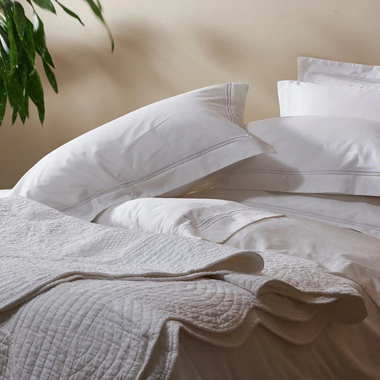 Eclectic Saxon white cotton sateen duvet set with elegant tonal satin-stitched border detail on pillows and cover