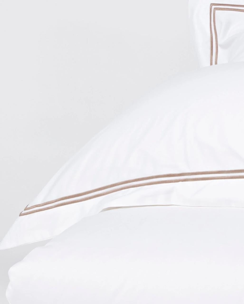 Eclectic Saxon white cotton sateen duvet cover set featuring elegant double stone-coloured satin stitch detailing.