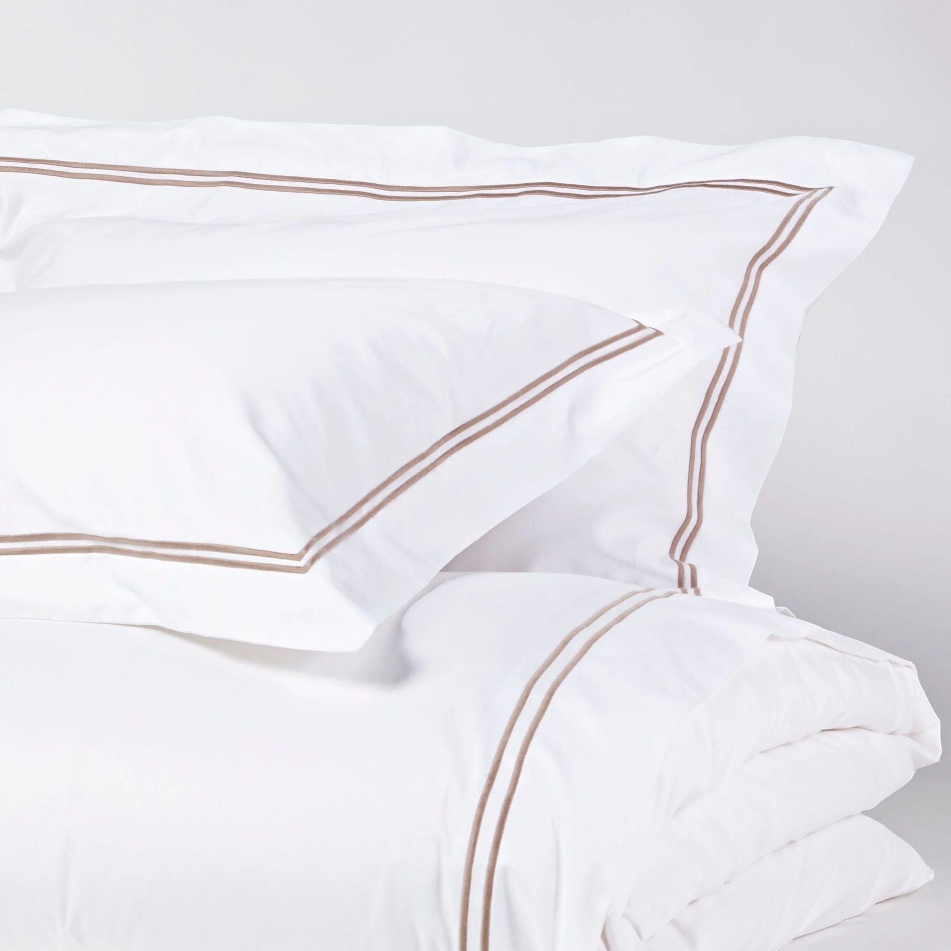Eclectic Saxon white cotton sateen duvet cover set with elegant stone-coloured double satin stitch detail.