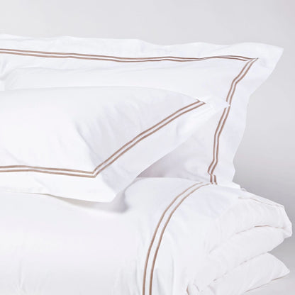 Eclectic Saxon white cotton sateen duvet cover set with elegant stone-coloured double satin stitch detail.