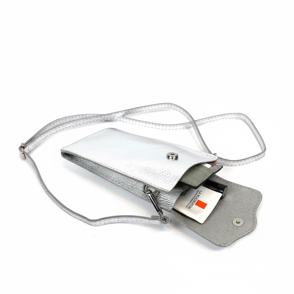 Eclectic silver pebbled leather phone crossbody bag with magnetic closure, adjustable strap, and internal pockets.