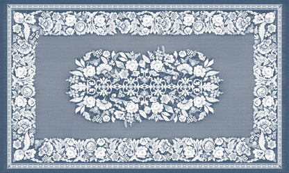 Eclectic soft blue linen-look tablecloth featuring a detailed white floral pattern and elegant European-style border.