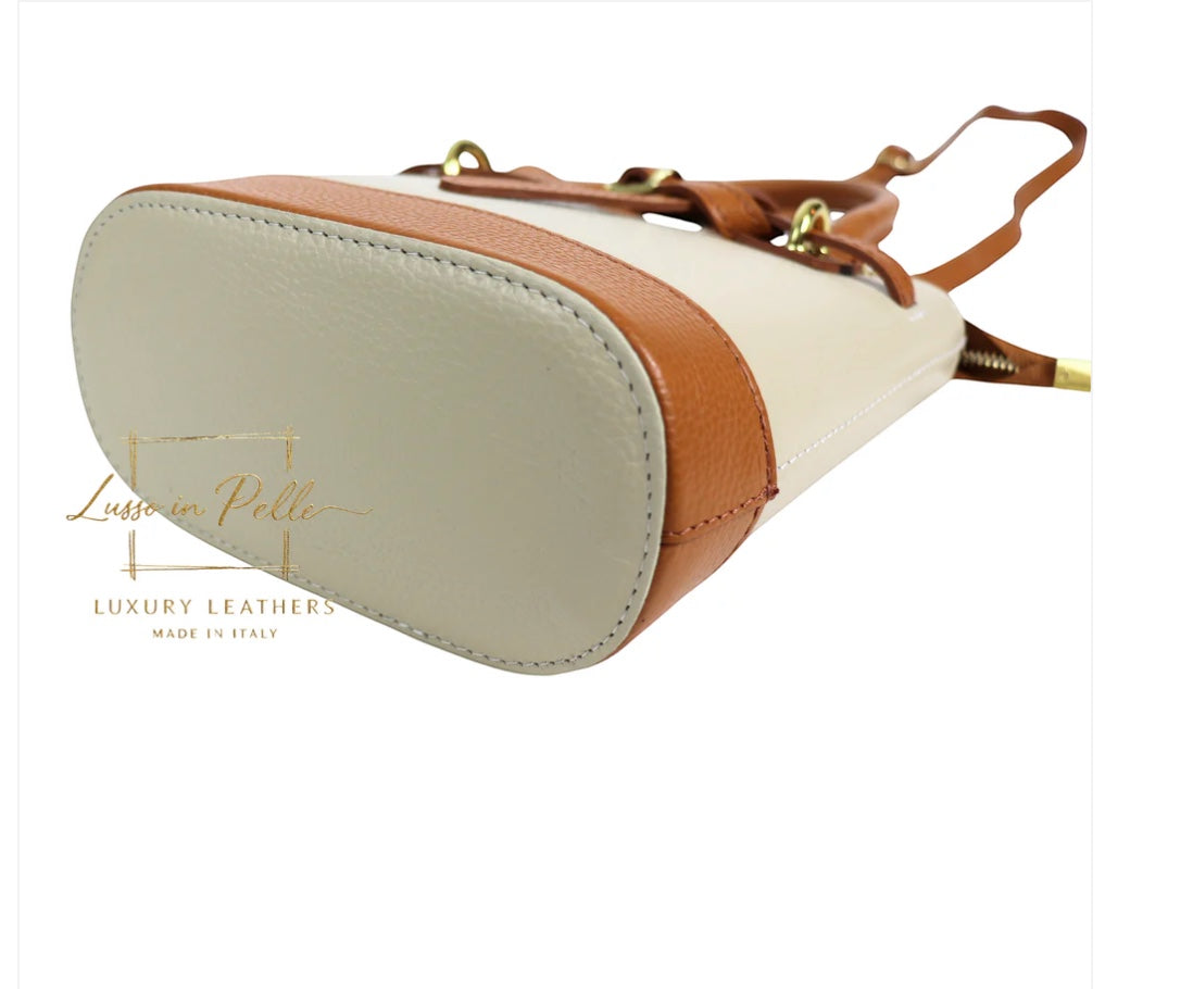 Eclectic Sorrento crossbody bag in cream and tan grain leather with gold-tone hardware and structured base view