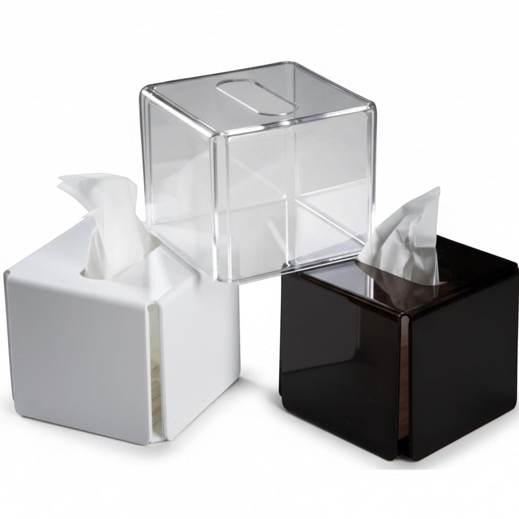 Eclectic modern square acrylic tissue box covers in clear, white, and black gloss finishes for minimalist decor.