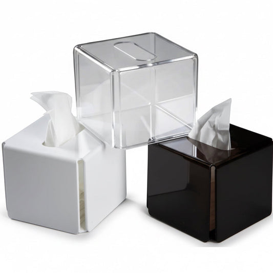 Eclectic modern square acrylic tissue box covers in clear, white, and black gloss finishes for minimalist decor.