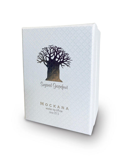 Eclectic Sugared Grapefruit diffuser in a white textured presentation box with a silver tree logo.