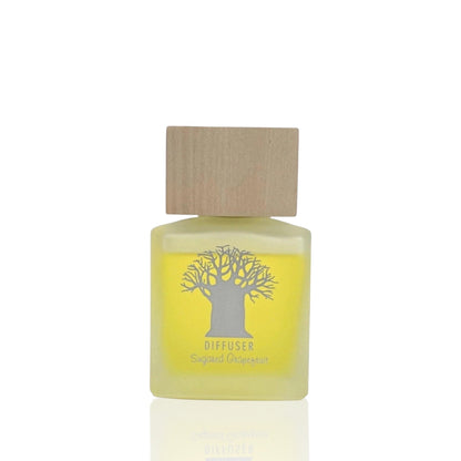 Eclectic Sugared Grapefruit diffuser in a frosted glass bottle with a natural wooden lid and tree logo.