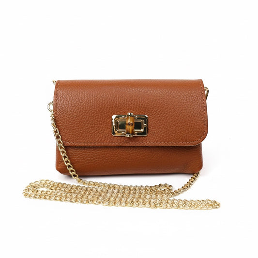 Eclectic tan pebbled leather clutch with a bamboo-inspired gold clasp and detachable gold chain shoulder strap.