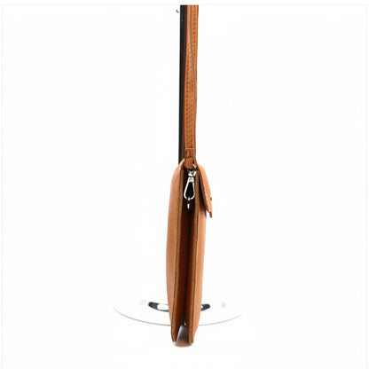 Eclectic tan pebbled leather phone crossbody bag with a slim profile and silver hardware, side view.